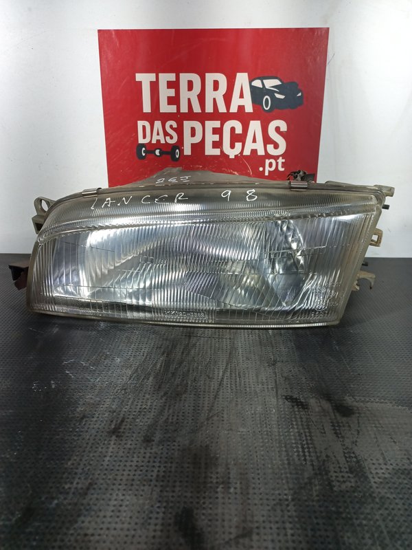 Farol Frontal MITSUBISHI Lancer VI esquerdo MB907213